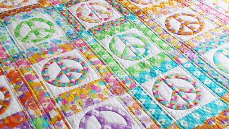 pastel quilt with peace signs
