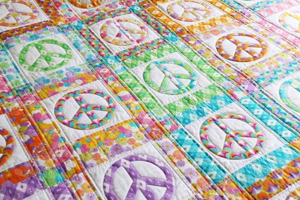 pastel quilt with peace signs